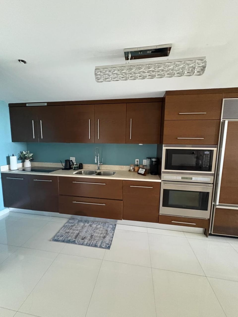Kitchen or kitchenette, dishwasher, oven, stove