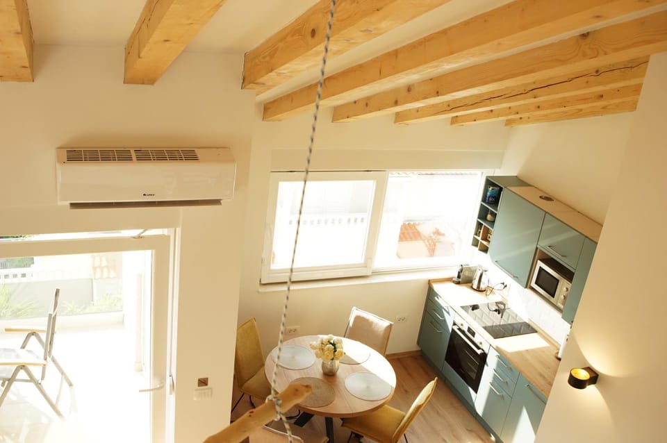 Kitchen or kitchenette, Seating area, Dining area, oven, stove, kitchen, air conditioner