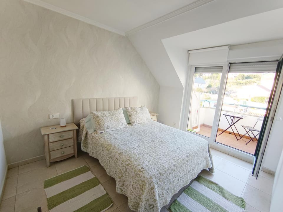 Precioso ático con vistas a pie de playa Apartment in Sanxenxo