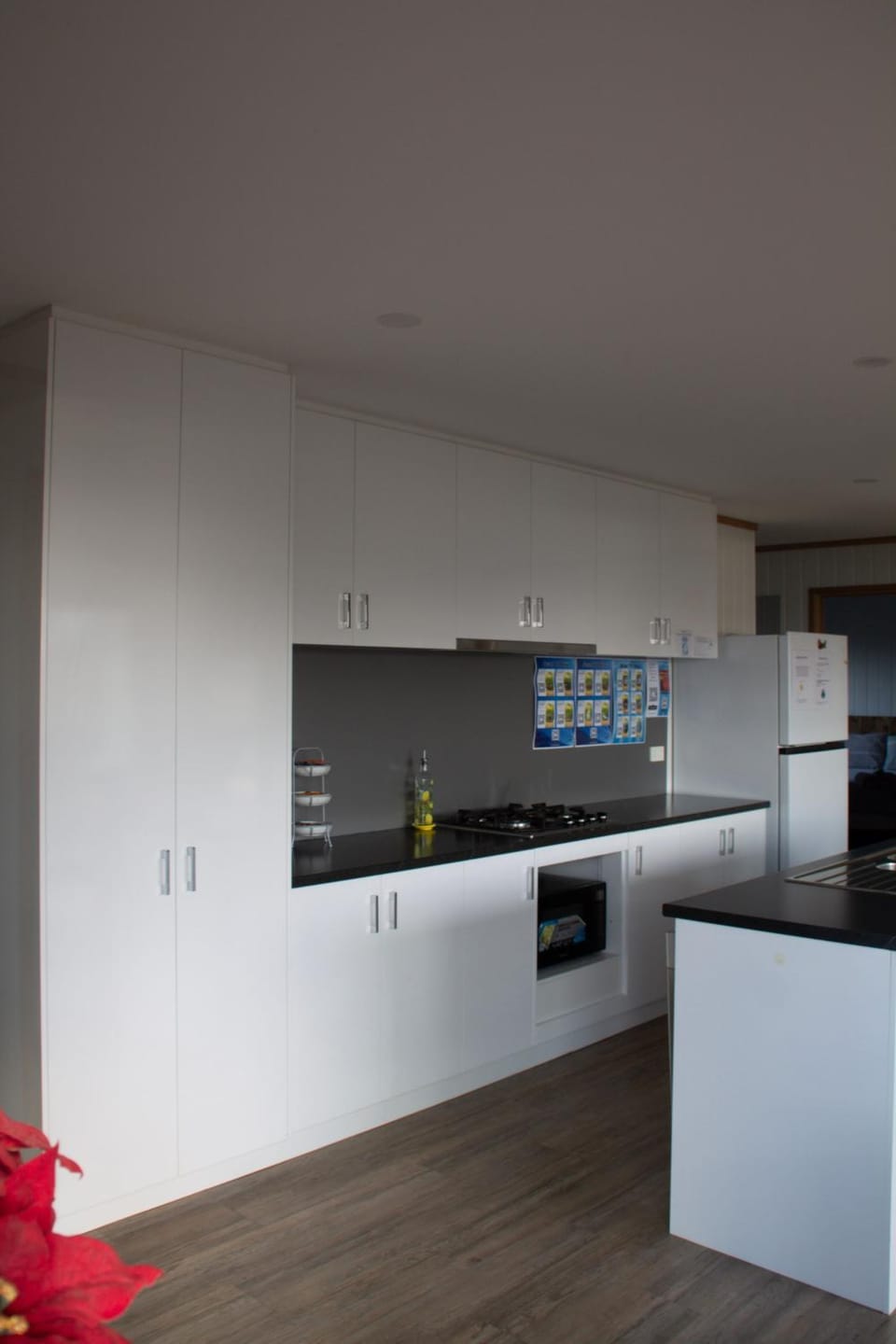 Kitchen or kitchenette, dishwasher, oven, stove