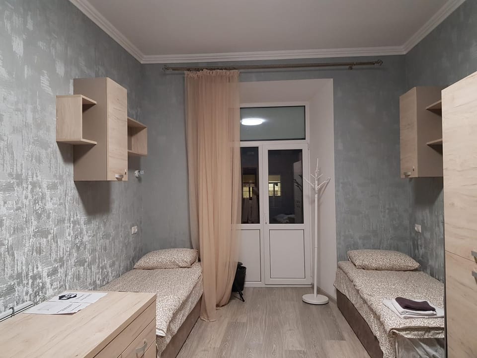 Bed, Photo of the whole room, Decorative detail, Bedroom, microwave, storage, towels