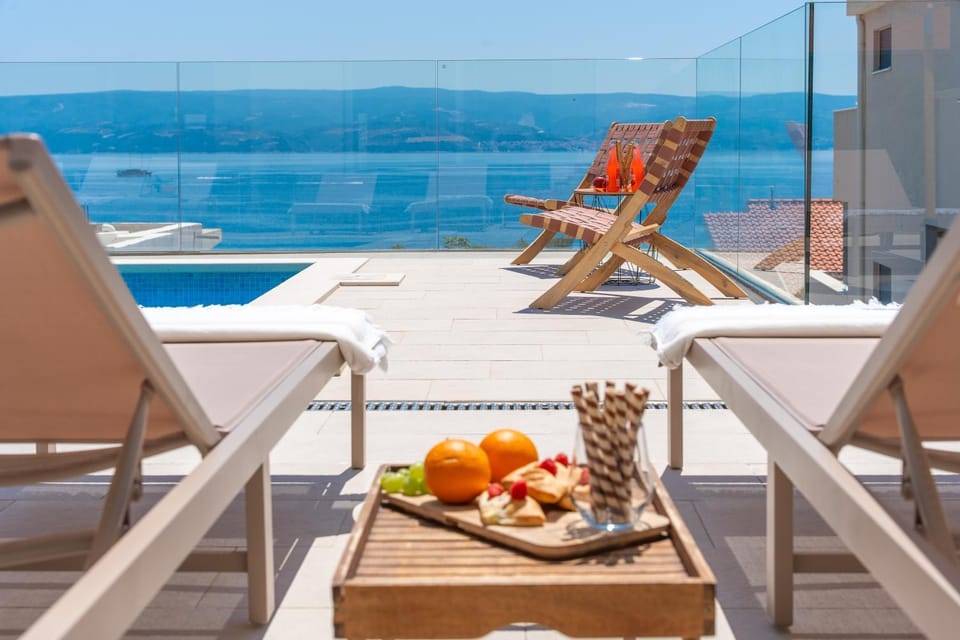 Patio, Day, Natural landscape, View (from property/room), Balcony/Terrace, Living room, Seating area, Dining area, Pool view, Sea view, Swimming pool, sunbed