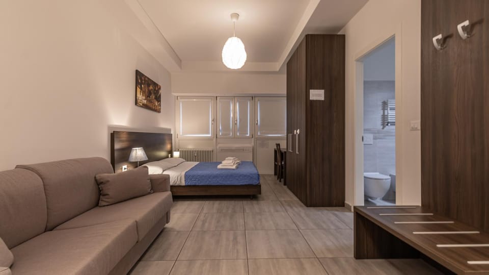 Toilet, Bed, Bathroom, Living room, Photo of the whole room, Decorative detail, Seating area, Bedroom, heating, towels, wardrobe
