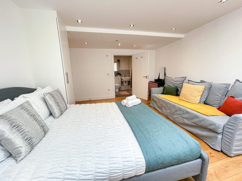 Bed, Bathroom, Seating area, Bedroom, flat iron, hair dryier, heating, storage, towels, wardrobe