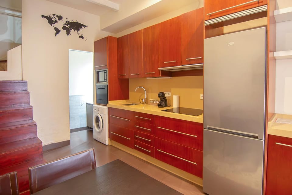 Kitchen or kitchenette, microwave, oven, stove, washing machine, kitchen