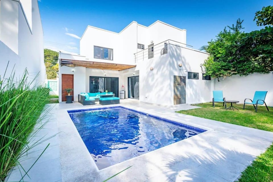Ultramodern Townhome with an Inviting Coastal Design and Lush Outdoor Oasis with a Private Pool House in Guanacaste Province