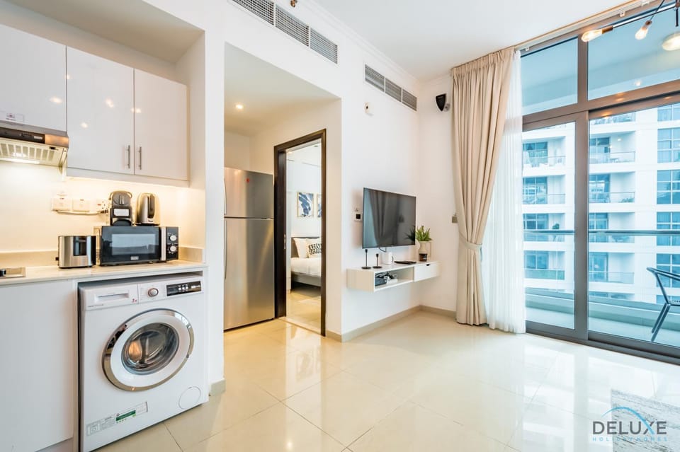 Kitchen or kitchenette, stove, toaster, washing machine