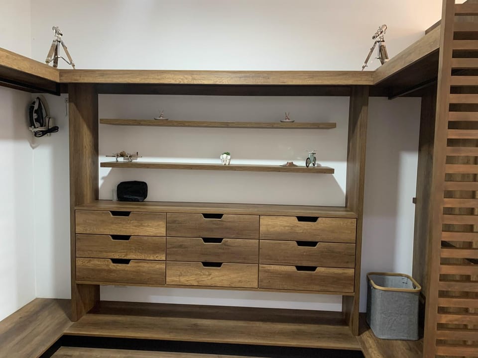 Decorative detail, flat iron, hair dryier, storage, towels, trouser press, wardrobe