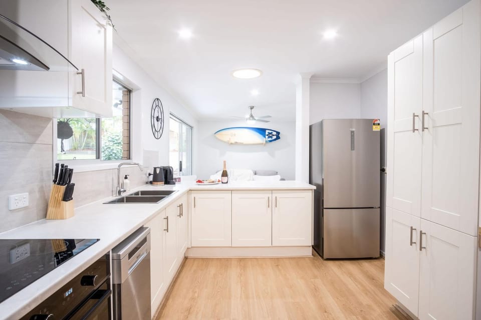 Kitchen or kitchenette, dishwasher, oven, stove