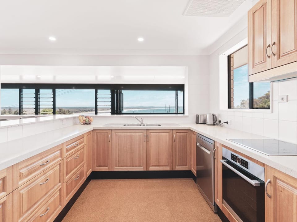 Kitchen or kitchenette, dishwasher, oven, stove