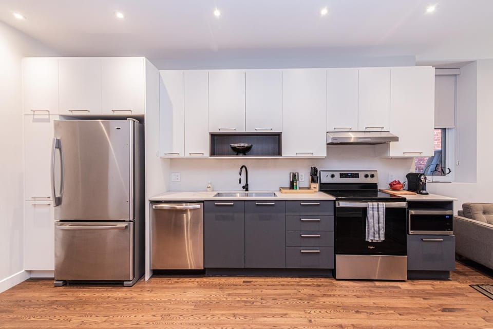 Kitchen or kitchenette, dishwasher, oven, stove