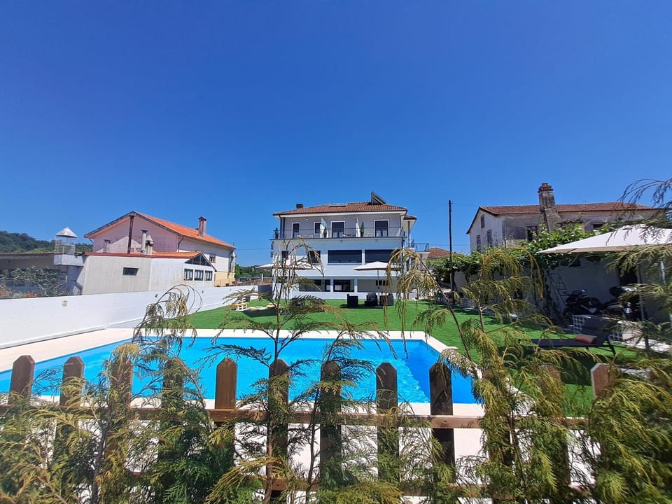 Property building, Day, Pool view, Swimming pool, sunbed