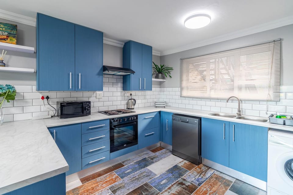 dishwasher, flat iron, microwave, oven, stove, toaster, washing machine, kitchen