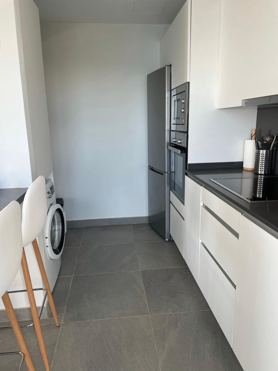 Kitchen or kitchenette, oven, stove, washing machine