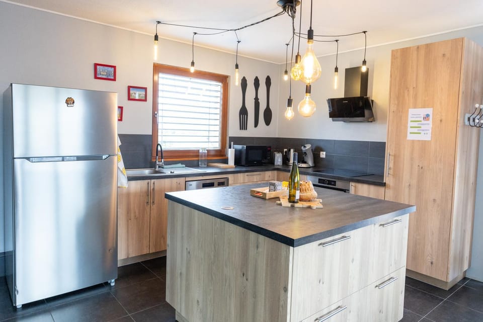 Kitchen or kitchenette, dishwasher, oven, stove