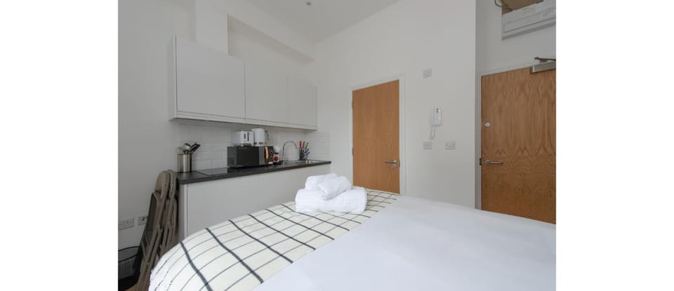 Bed, Kitchen or kitchenette, Bedroom, stove, towels
