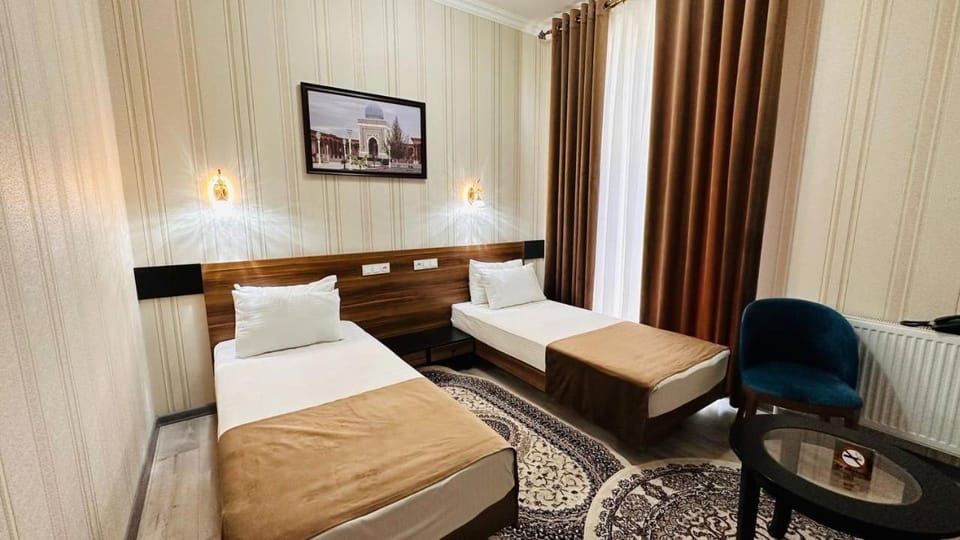 Bed, TV and multimedia, Living room, Seating area, Bedroom