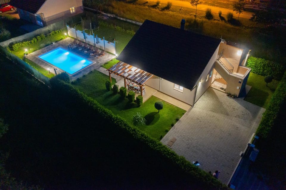 Property building, Patio, Night, Garden, Garden view, Pool view, Swimming pool, sunbed