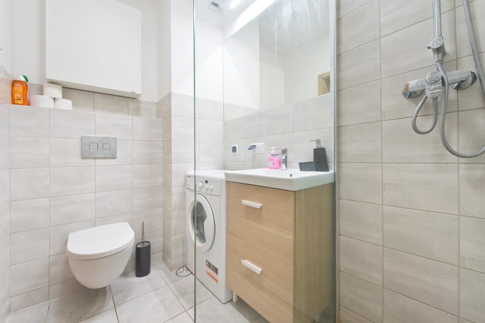 Shower, Toilet, Bathroom, towels, washing machine, dryer