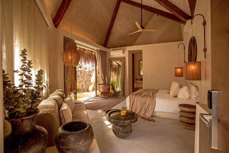 Bed, Living room, Photo of the whole room, Decorative detail, Seating area, Bedroom, fireplace, hair dresser