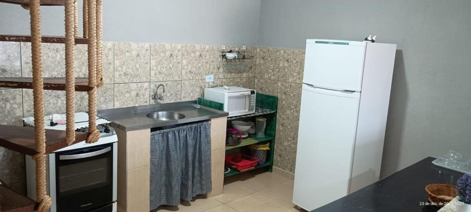 Kitchen or kitchenette, microwave, oven, stove