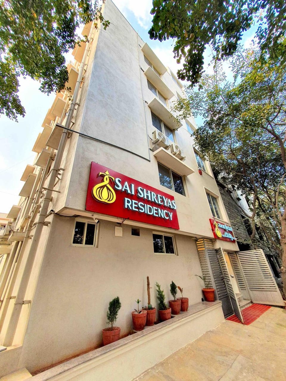 Property building, Facade/entrance, Day, Property logo or sign, View (from property/room), Logo/Certificate/Sign, Street view, Quiet street view