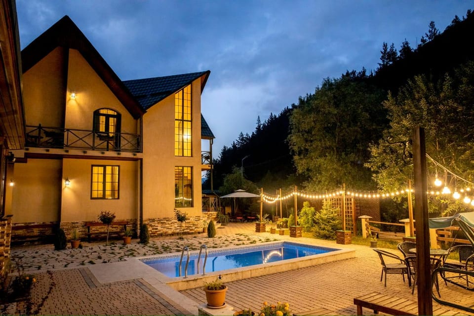 Property building, Patio, Night, Natural landscape, Garden, Garden view, Pool view, Swimming pool, sunbed