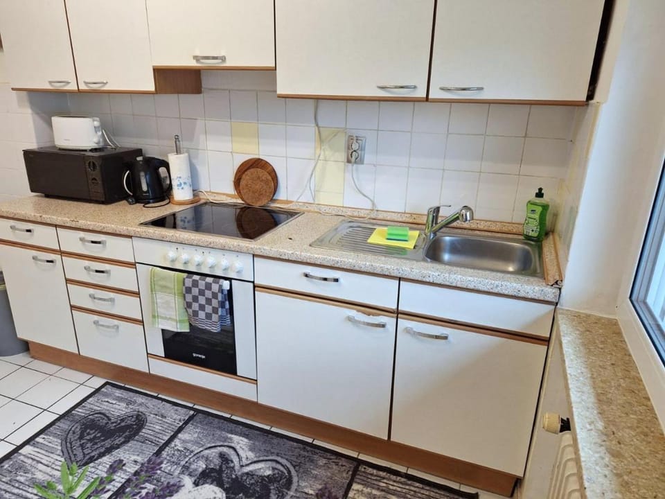 Kitchen or kitchenette, oven, stove, toaster