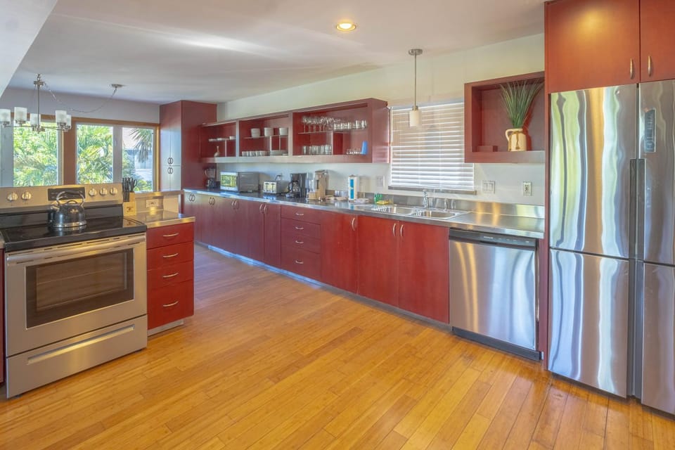 Kitchen or kitchenette, dishwasher, oven, stove