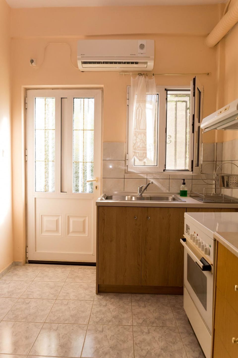 Kitchen or kitchenette, stove, air conditioner