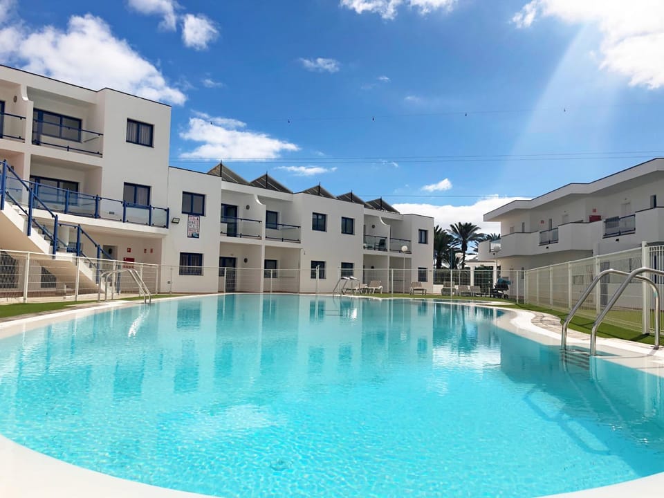 Property building, Day, Pool view, Swimming pool, sunbed