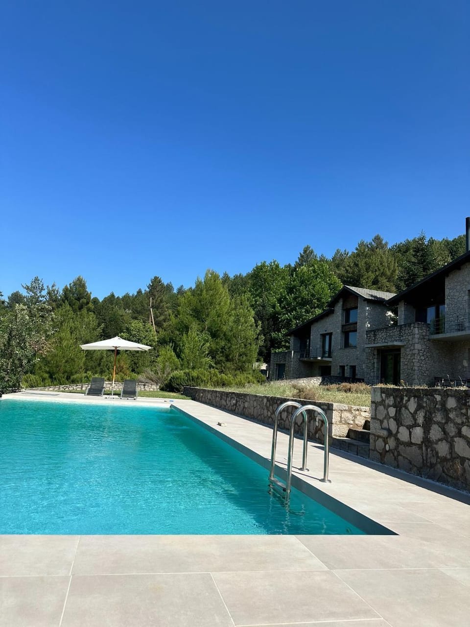 Property building, Day, Natural landscape, Pool view, Swimming pool, sunbed