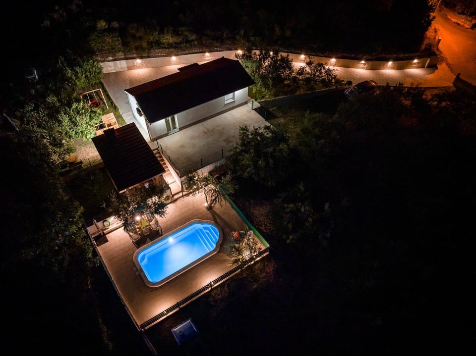 Property building, Night, Natural landscape, Pool view, Swimming pool