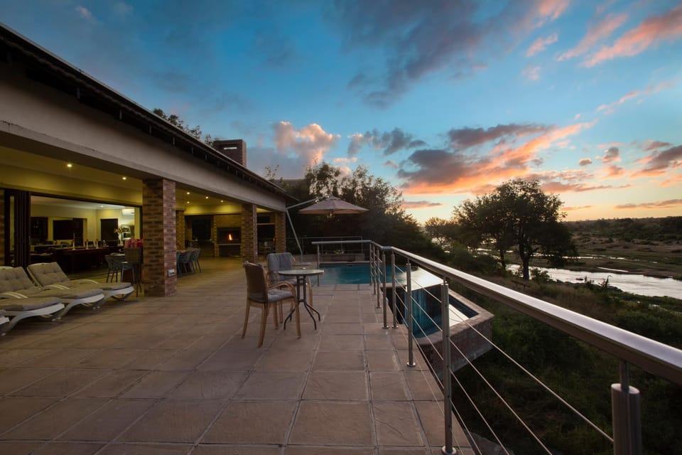 Patio, Balcony/Terrace, Seating area, Pool view, River view, Swimming pool, Sunset