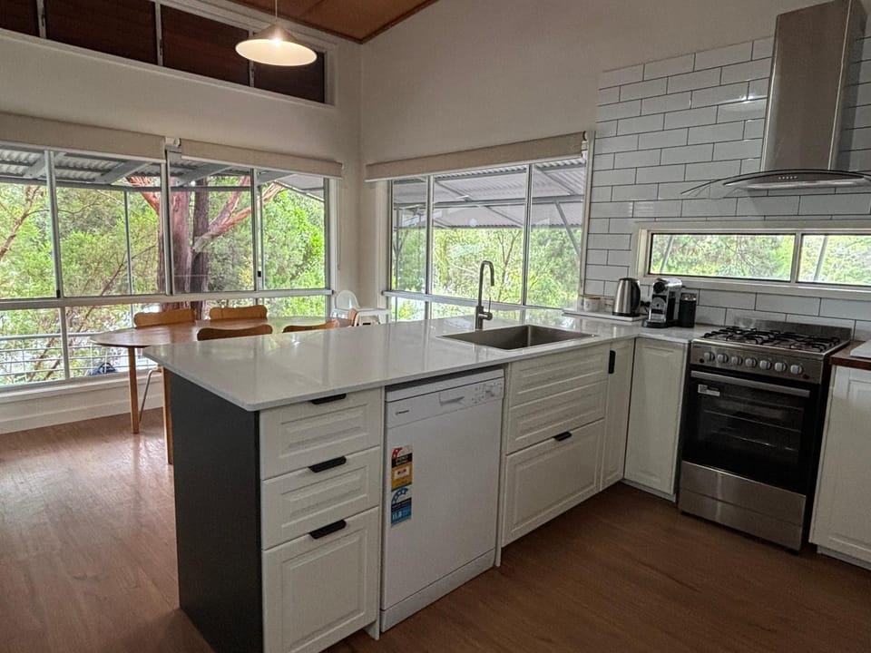 Kitchen or kitchenette, dishwasher, oven, stove