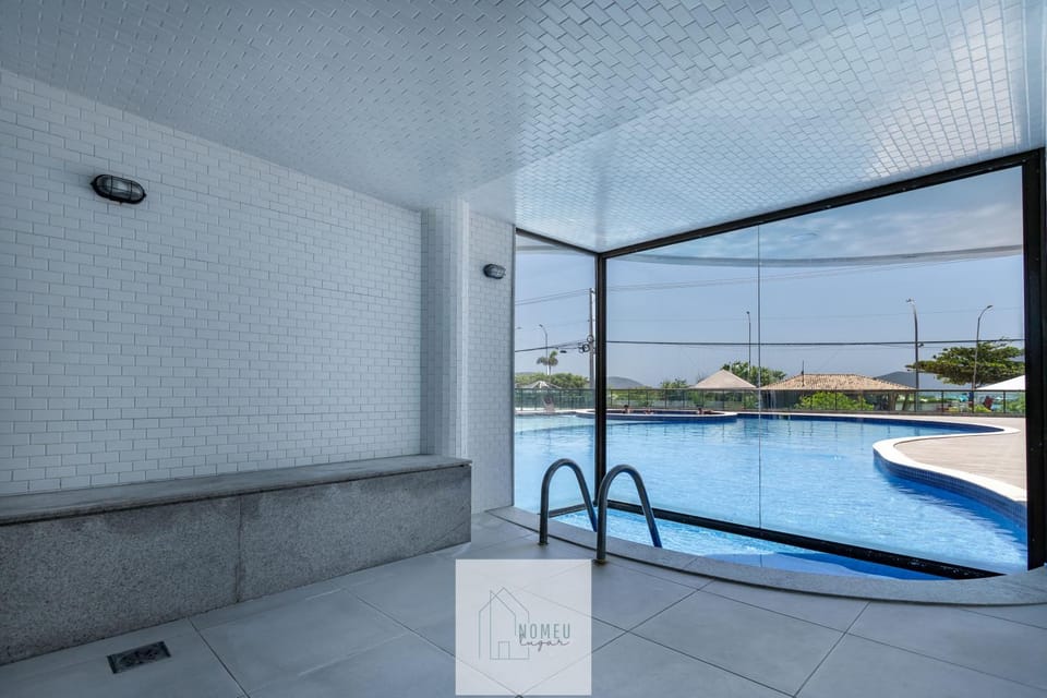Condomínio Club a 50m PRAIA dos Anjos - Unidades com 2 QUARTOS, PISCINA, estacionamento e portaria 24h - Área de lazer 3000m, wi-fi 800MB, churrasqueira e cozinha completa Apartment in State of Rio de Janeiro