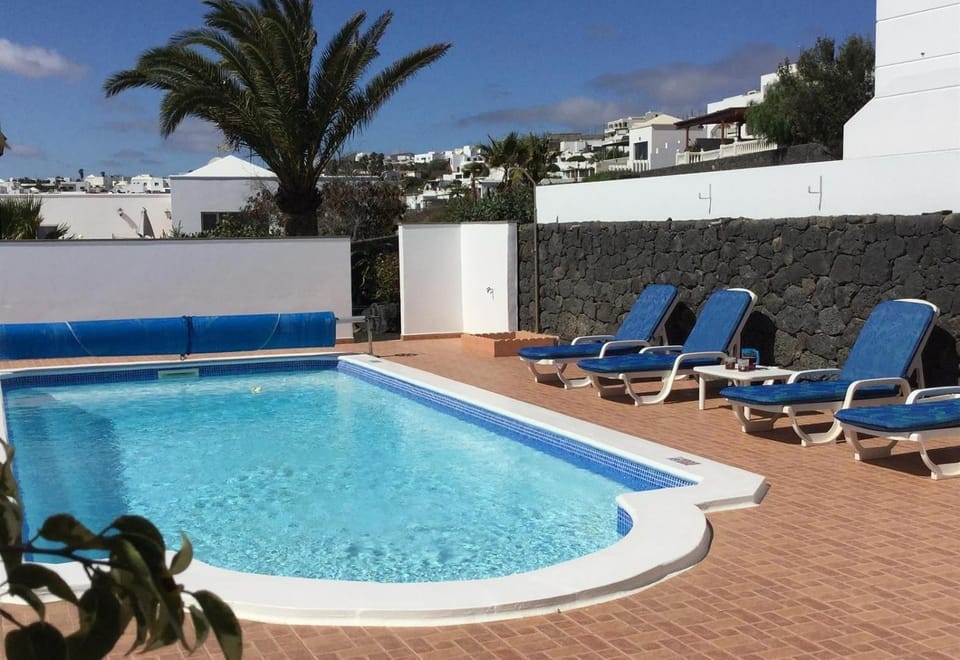 Property building, Living room, Swimming pool