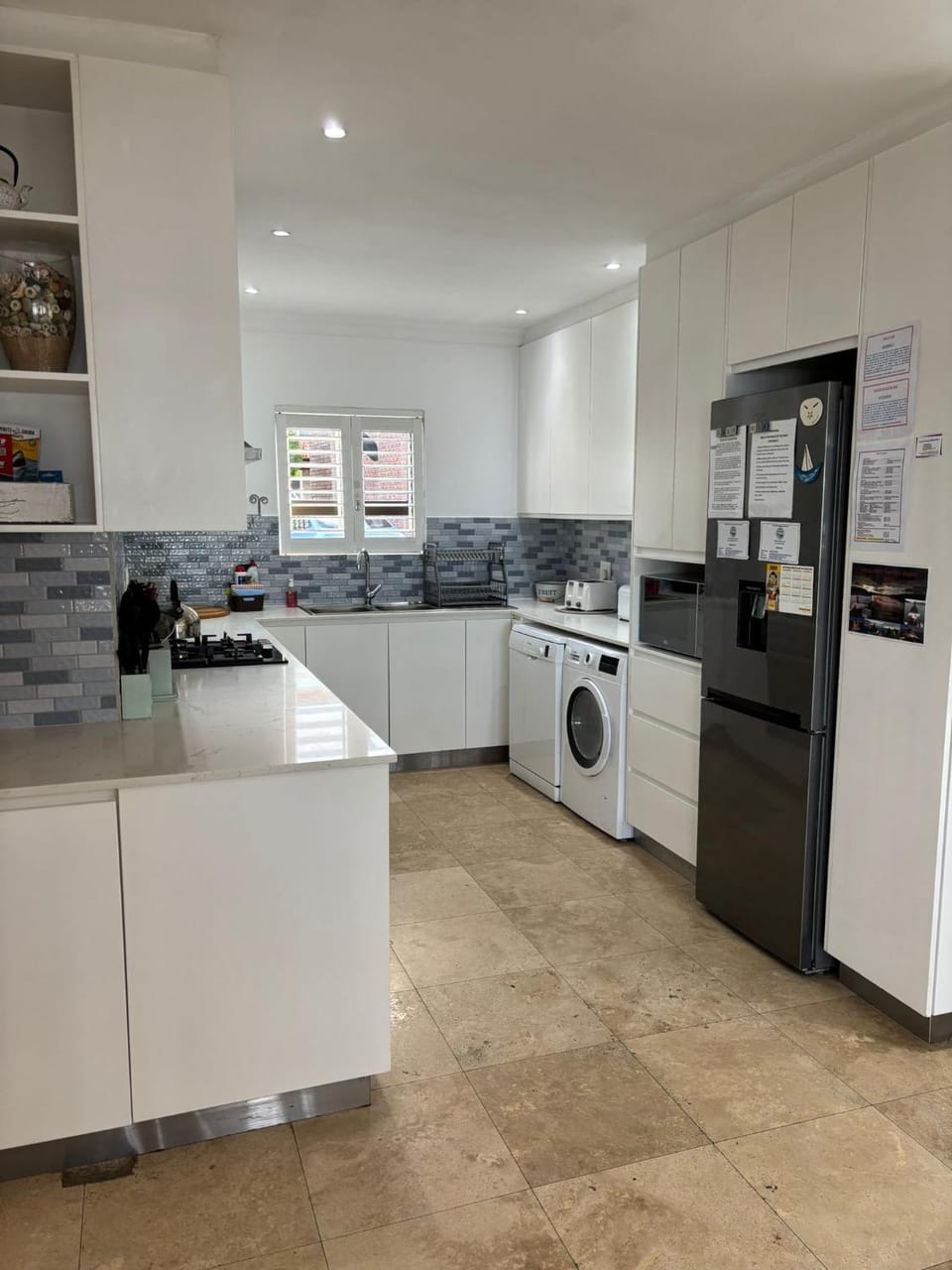 Kitchen or kitchenette, dishwasher, oven, stove, toaster, washing machine