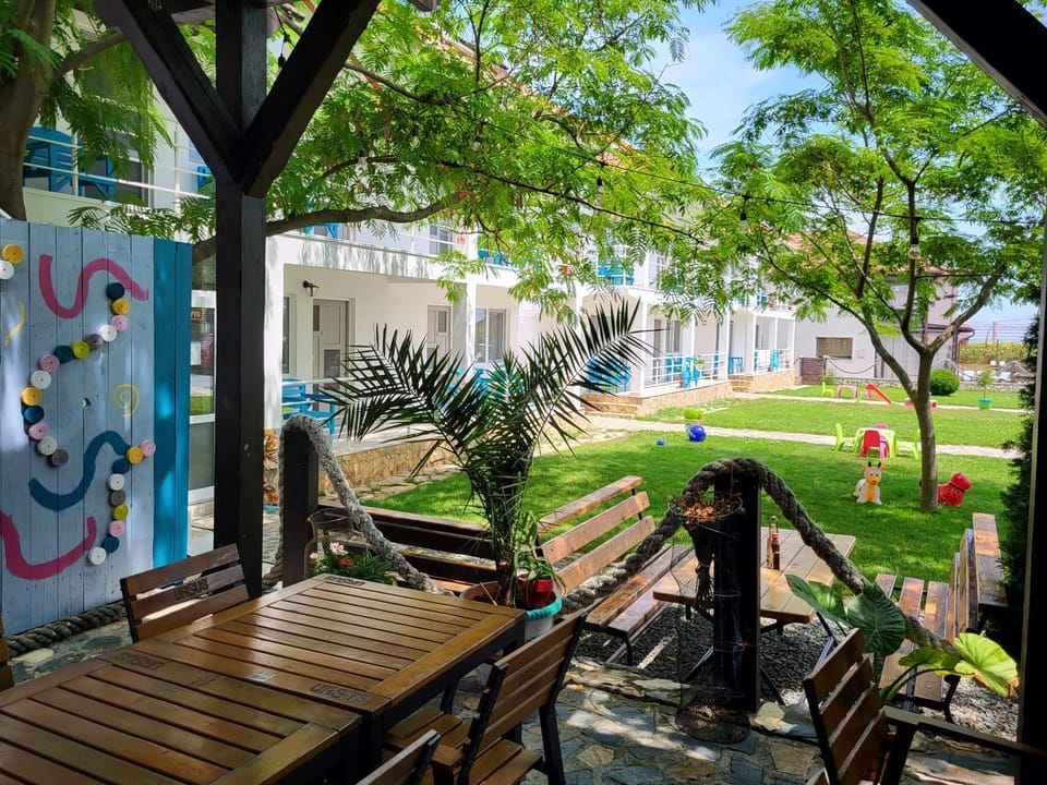 Property building, Restaurant/places to eat, Day, Children play ground, Garden, Garden view