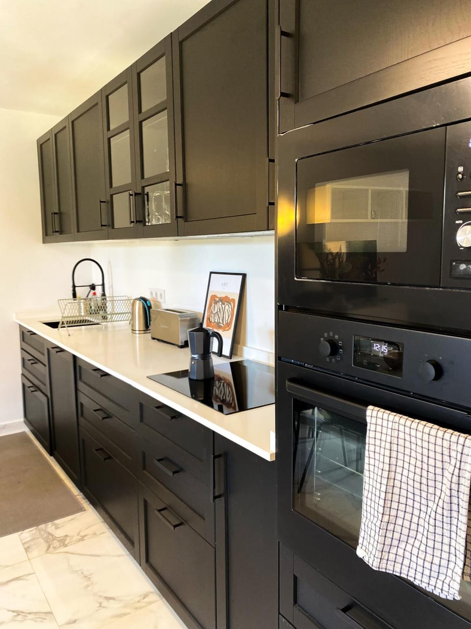 Kitchen or kitchenette, dishwasher, oven, stove, toaster