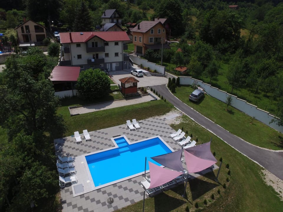 Property building, Natural landscape, Bird's eye view, Swimming pool, sunbed