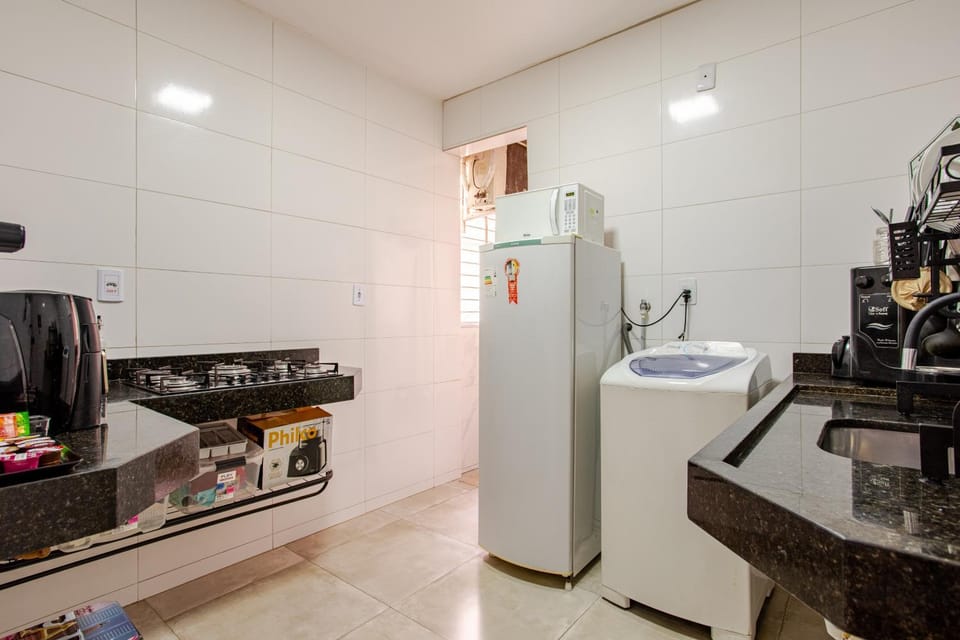Kitchen or kitchenette, stove, washing machine