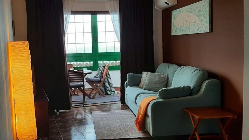 Living room, Seating area, Sea view, air conditioner