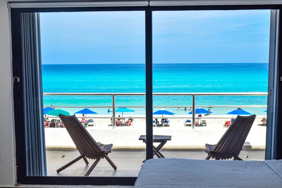 Bed, Day, Natural landscape, View (from property/room), Balcony/Terrace, Photo of the whole room, Beach, Bedroom, Sea view, sunbed, air conditioner