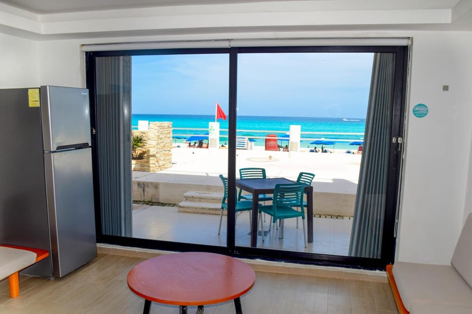 Patio, Day, Natural landscape, View (from property/room), Living room, Dining area, Beach, Sea view, air conditioner