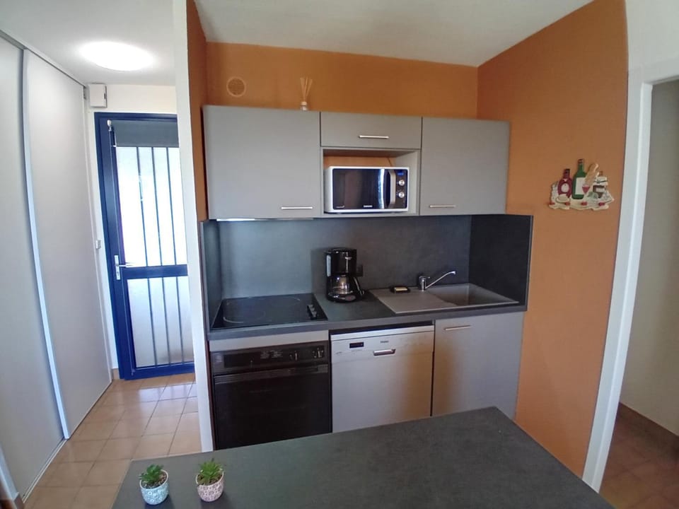 Kitchen or kitchenette, oven, stove, toaster