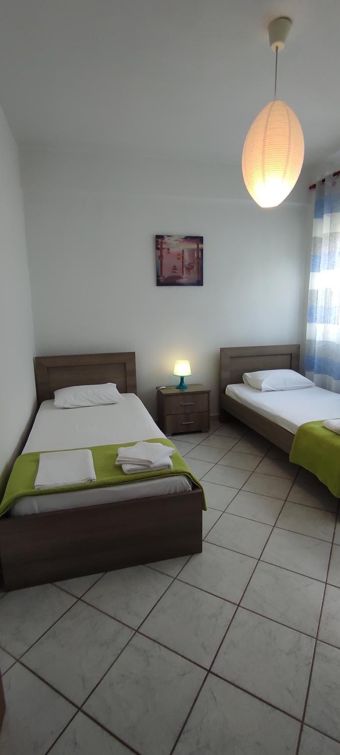 Bed, Bedroom, hair dryier, locker, towels