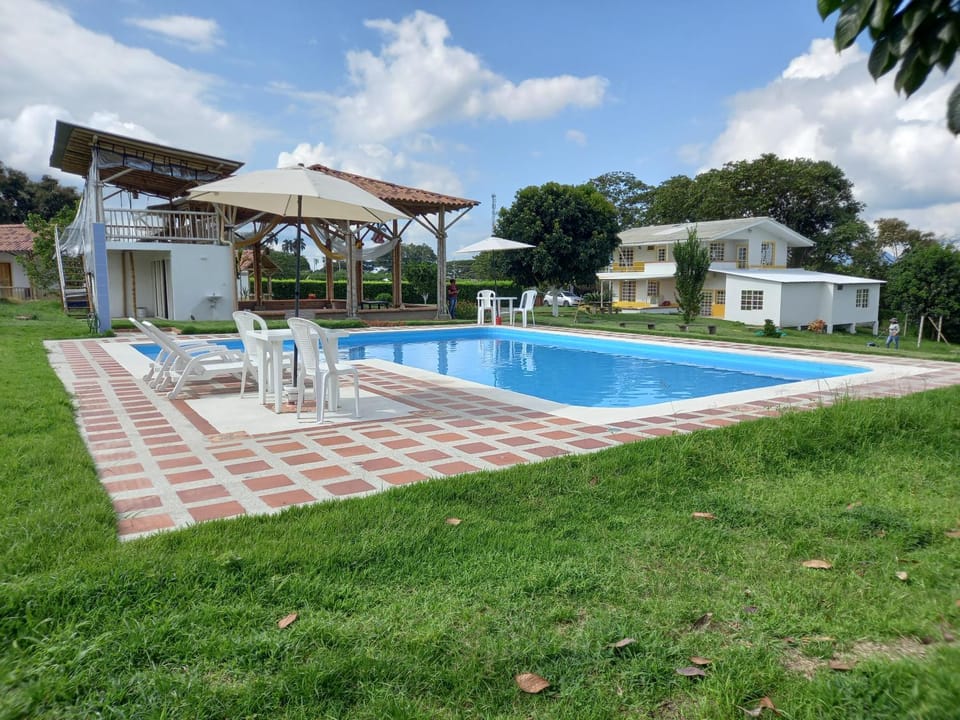 Property building, Patio, Day, Garden, Garden view, Pool view, Swimming pool, sunbed