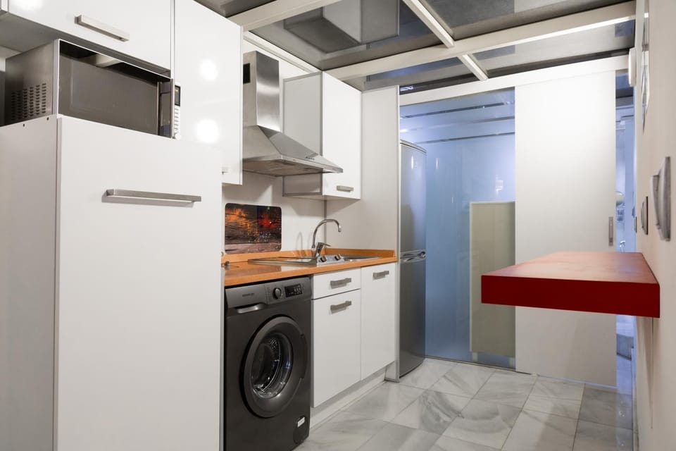 Kitchen or kitchenette, stove, washing machine