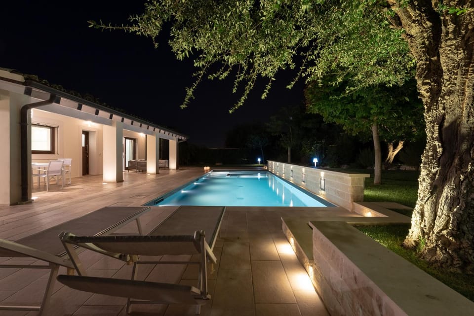 Property building, Patio, Night, Pool view, Swimming pool